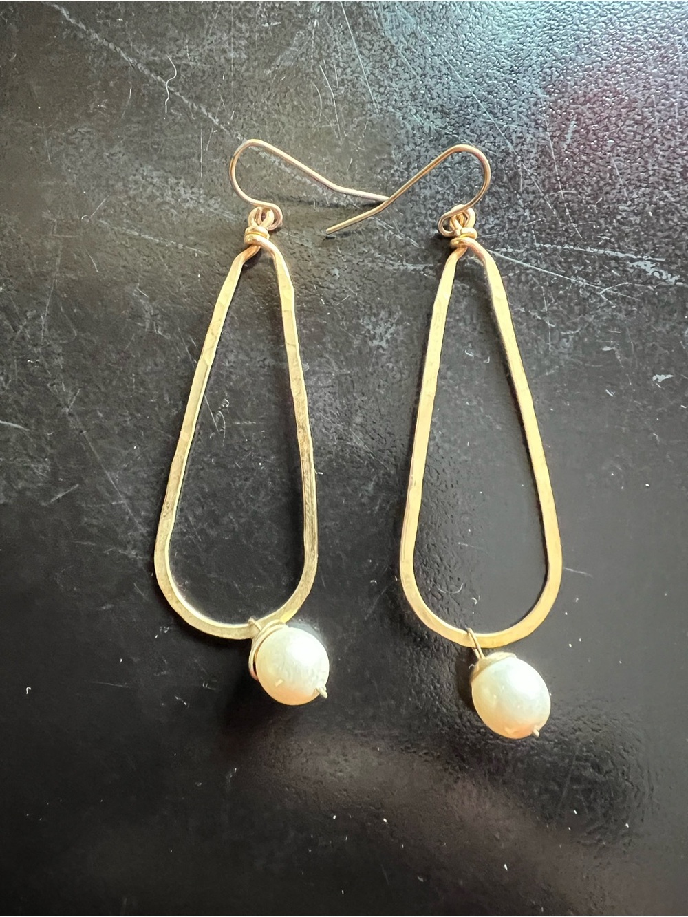 Elegant gold tone tear drop earrings with a single real pearl at bottom.